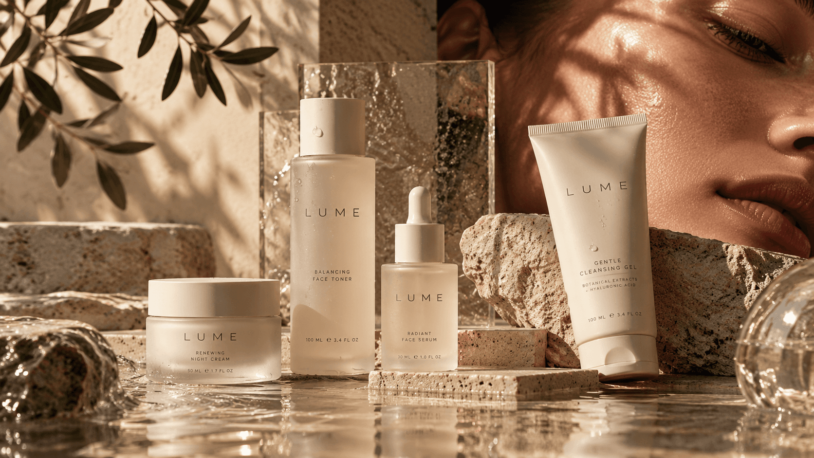 LUME skincare bottles, jar and tube on wet stone beside olive leaves